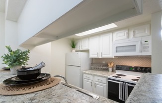 This is a photo of the kitchen of the 575 square foot 1 bedroom, 1 bath apartment at Canyon Creek Apartments in Dallas, TX