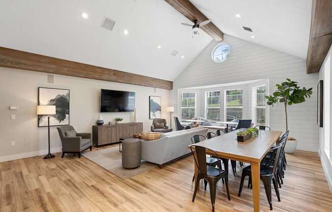 a living room with a dining room table and a couch