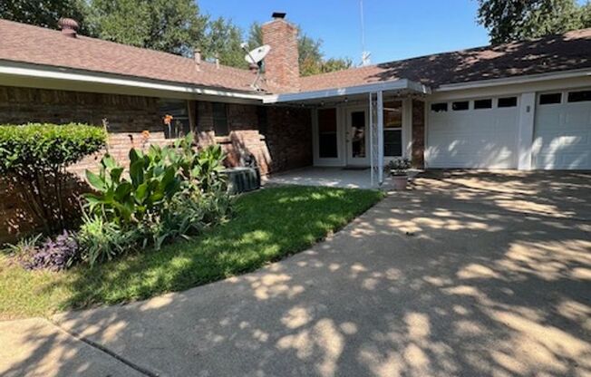Charming 3-Bedroom Home with Gorgeous Trees in Prime Hurst Location!