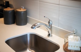 The Byway | Model #105 Solid Surface Countertops and Modern Backsplash Tile