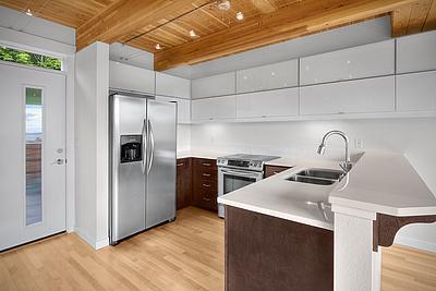 INDUSTRIAL-STYLE QUEEN ANNE TOWNHOUSE WITH VIEWS OF THE WATER FROM EVERY FLOOR!