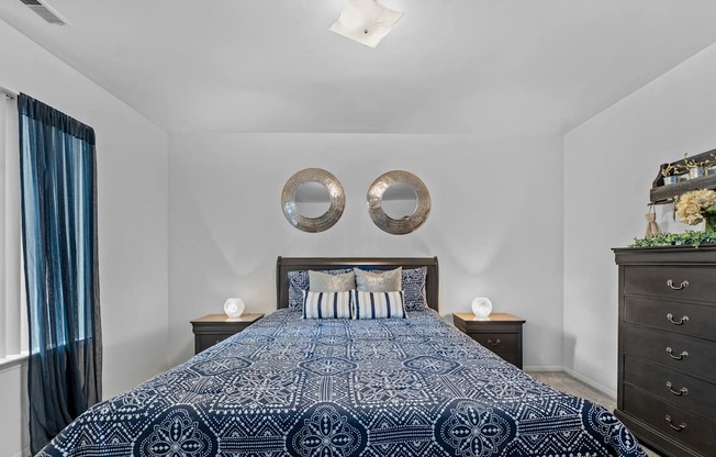 Comfortable bedroom with natural lighting at Westwood Village Apartments in Westland, MI