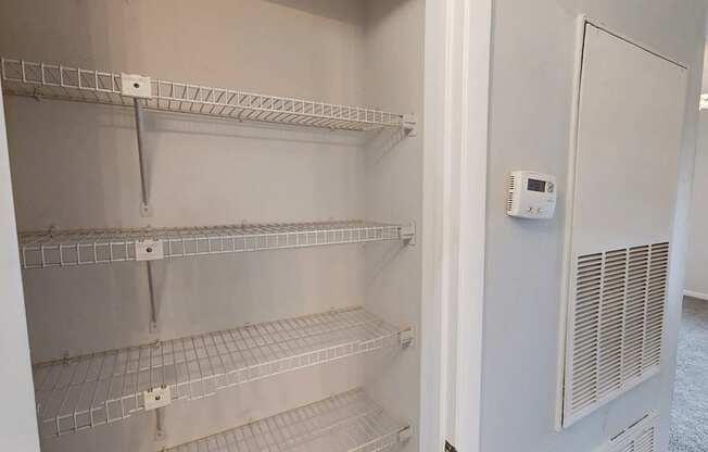 A white refrigerator with a digital display on the door.