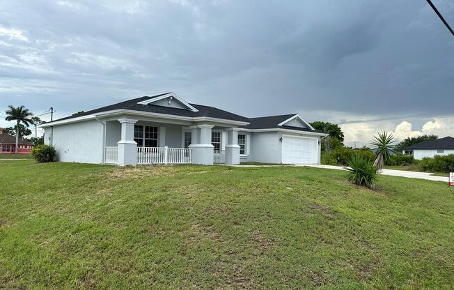 Spacious 3-Bed + Den Home with 2-Car Garage in NE Cape Coral. Special Offer! Qualify for a deposit-free option and save on move-in costs!