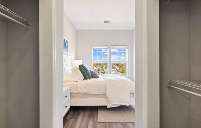 a bedroom with a bed and a window at Metro 303, Hempstead, 11550