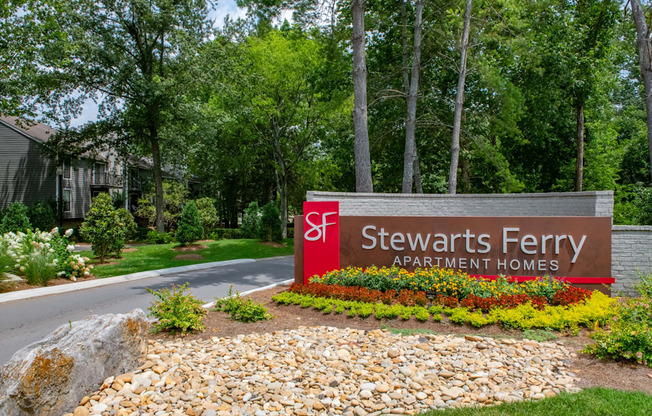 the sign for stevens ferry apartment homes in front of a road