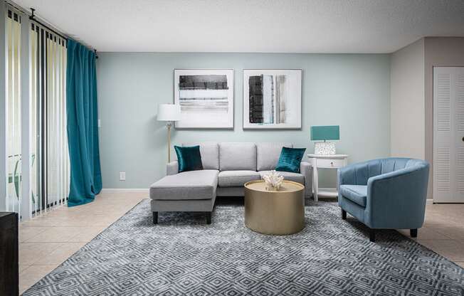 a living room with a couch and a chair at Fairways of Inverrary, Florida