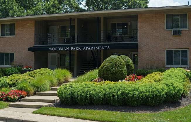 a building with a sign that reads apartments