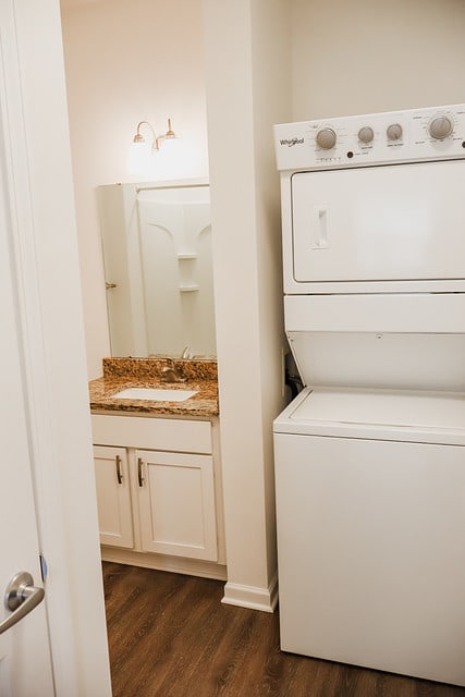 a white kitchen with a stove and a refrigerator