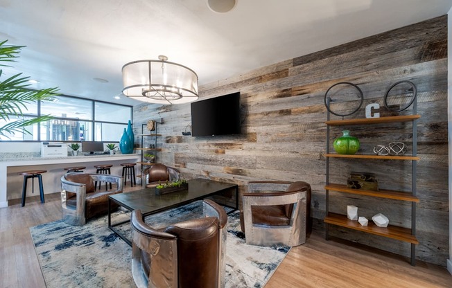 A modern living room with a wooden wall and a flat screen TV.