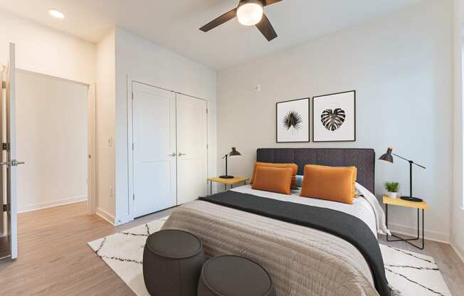 a bedroom with a large bed and a ceiling fan at The Box, Richmond, 23224