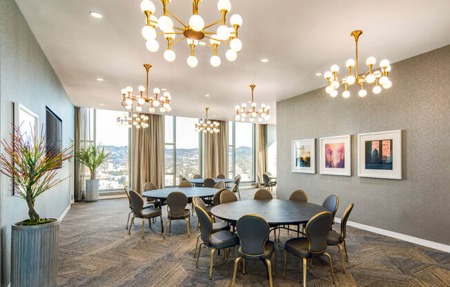 A dining room with a large table and chairs.