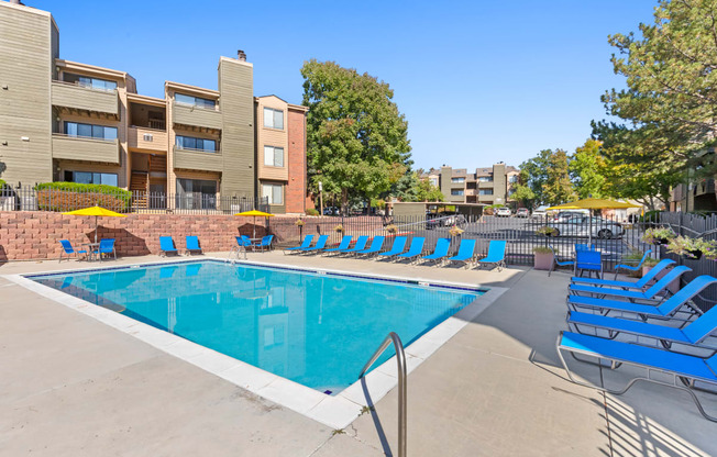 our apartments have a resort style pool with blue lounge chairs