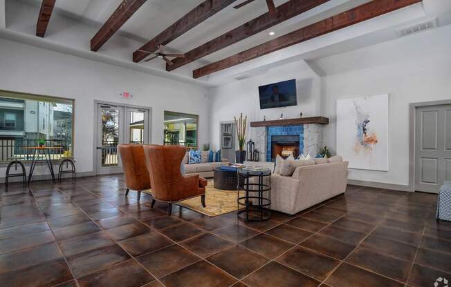 A living room with a fireplace and a TV mounted on the wall.