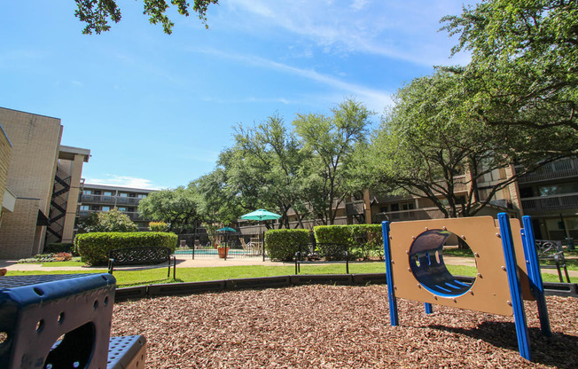 This is a photo of the playground at Harvard Square Apartments in Dallas, TX.