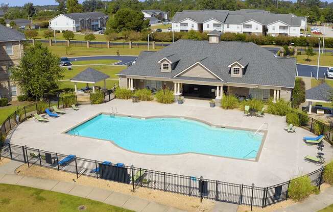 A large house with a pool in the backyard.