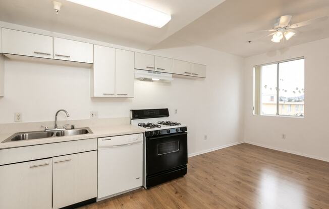 Kitchen with White Cabinets and Hardwood Floors