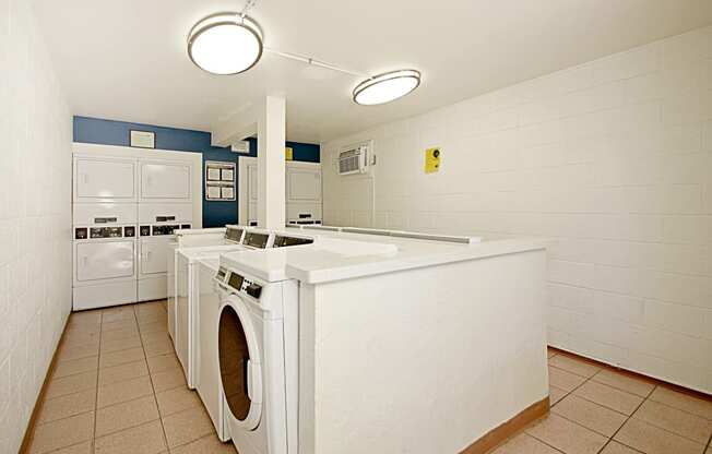 a kitchen with a washer and dryer and a counter with a washing machine