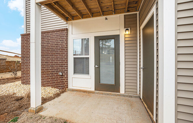 Private patio with a door to enclosed storage  at Signature Pointe Apartment Homes, Athens, 35611