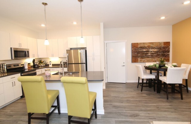 Wood Laminate Flooring flows throughout the common areas