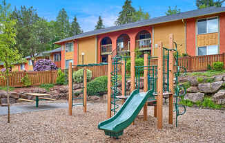 Heritage Woods playground with slide, climbing apparatus and picnic table