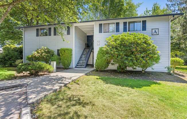 A house with a white exterior and a black door.