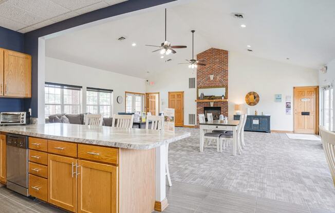 the view from the community kitchen into the living room and dining room of the clubhouse at Williamsburg Park