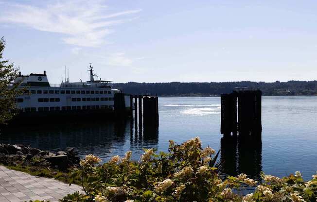 A large white boat is docked at a pier at Spyglass Hill Apartments, Bremerton, 98337