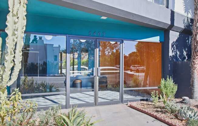 the front of a building with glass doors