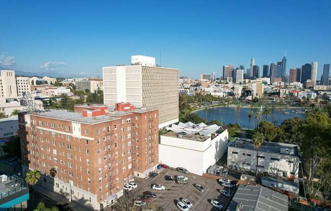 A large red brick building with a white building in front of it.