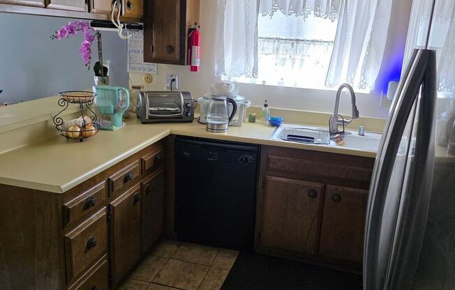 Spacious coastal close 2 bedroom condo with a detached 2 car garage