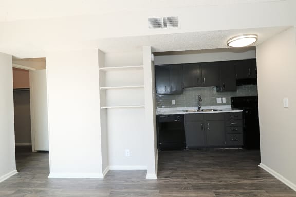 grey cabinets and hardwood flooring