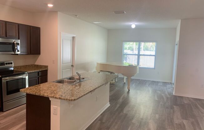 Beautiful Home Located In The New Chestnut Village Neighborhood On SW Archer Road