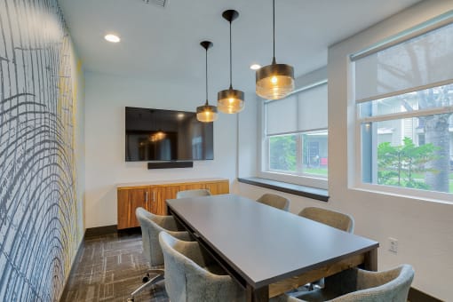 A conference room with a table and chairs at Kruseway Commons, apartments in Lake Oswego, Oregon