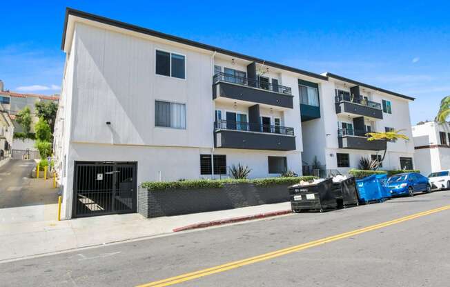 an apartment building with a truck parked in front of it