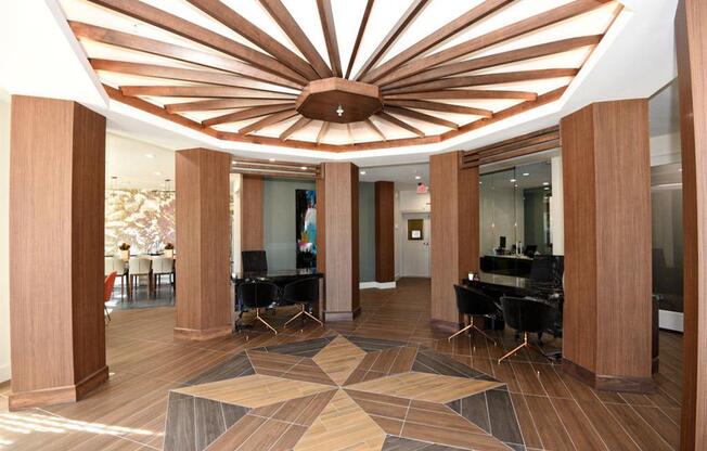 a view of the lobby with chairs and a ceiling light