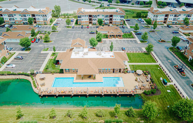 an aerial view of a large swimming pool in a parking lot