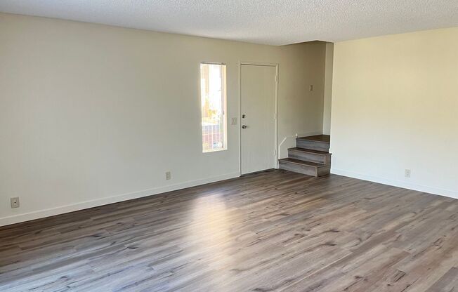 Large two-story townhouse with 3 bedrooms and 2 full baths and a private patio