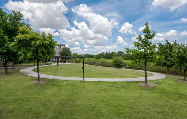 a park with trees and a circular walkway