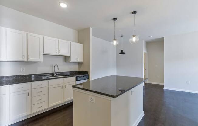 Ashland Farms Spacious Kitchen Layout with Island, Modern Light Fixtures, and White Cabinetry
