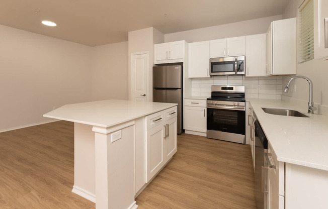 Kitchen with island and hard surface flooring