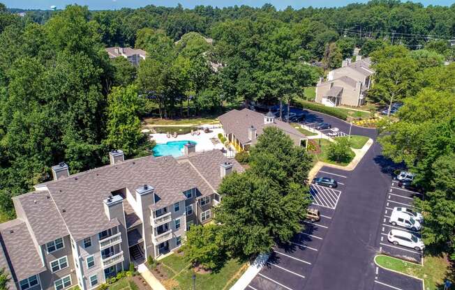 an aerial view of a large apartment complex with a swimming pool and parking lot at Hunters Chase Apartments, Midlothian, Virginia