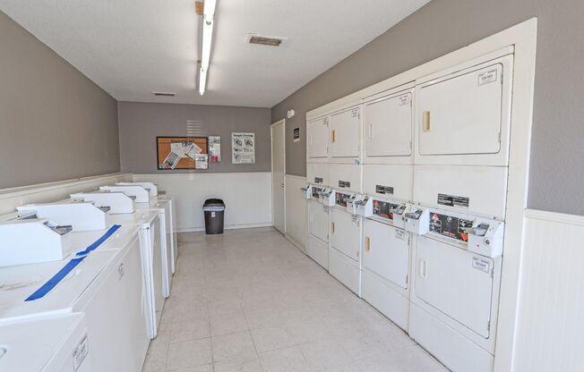 Onsite laundry room with washers and dryers at Laurel Parc apartments in Shreveport, LA.