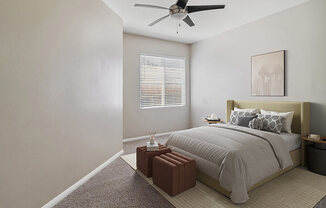 Model Bedroom with Carpet and Window View at Reserve at Rancho Apartments located in Moreno Valley, CA.