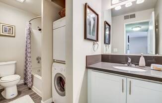 The Alexandar Apartments Bathroom with Washer and Dryer