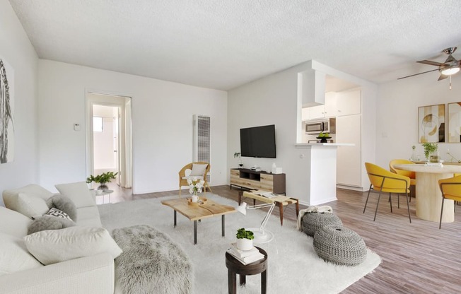 the living room of an apartment with a couch and a table