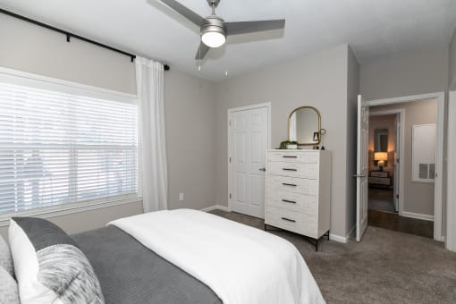 a bedroom with a bed and a ceiling fan at Willowest in Collier Hills, Georgia