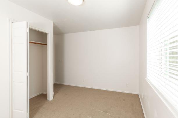 Bedroom with Closet at Devonshire Court Apartments & Townhomes, North Logan, 84341