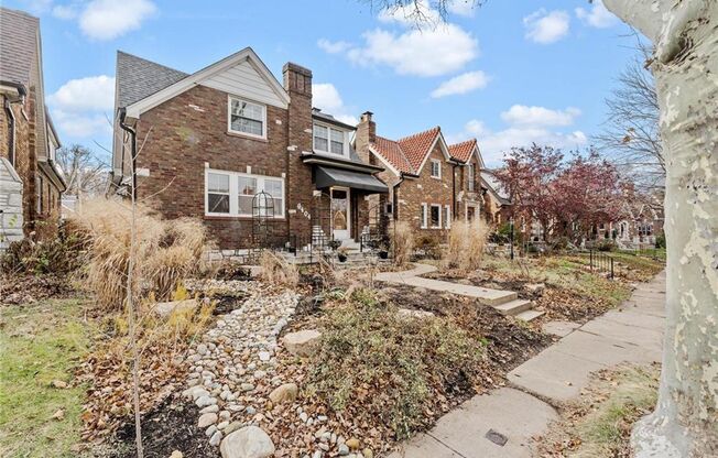 This charming gingerbread home in St. Louis Hills blends modern updates with classic appeal.