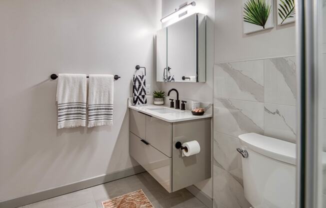 Walk-In Showers With Built-In Bench And Glass Enclosure at Residences at Richmond Trust, Richmond